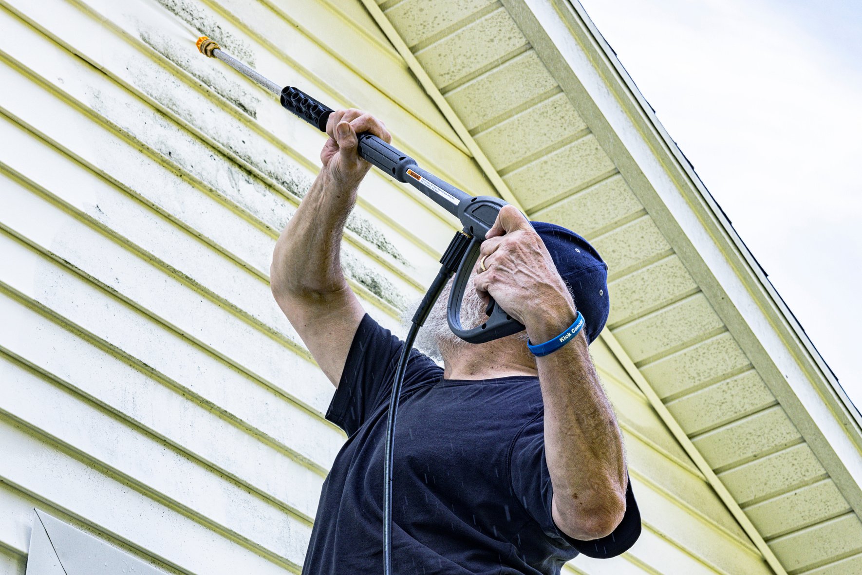 DIY Senior Man Cancer Survivor Power Washing House Siding